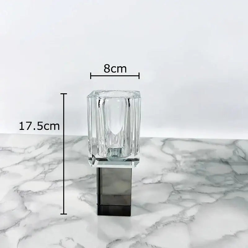 Clear glass candle holder with faceted rectangular design and dark gray base for decorbites geometric square artificial flowers decor