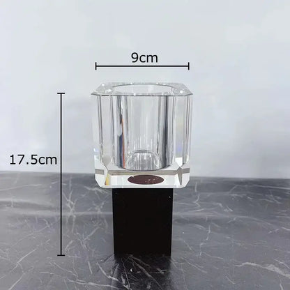Clear faceted crystal candle holder with black base complementing decorbites geometric square artificial flowers decor