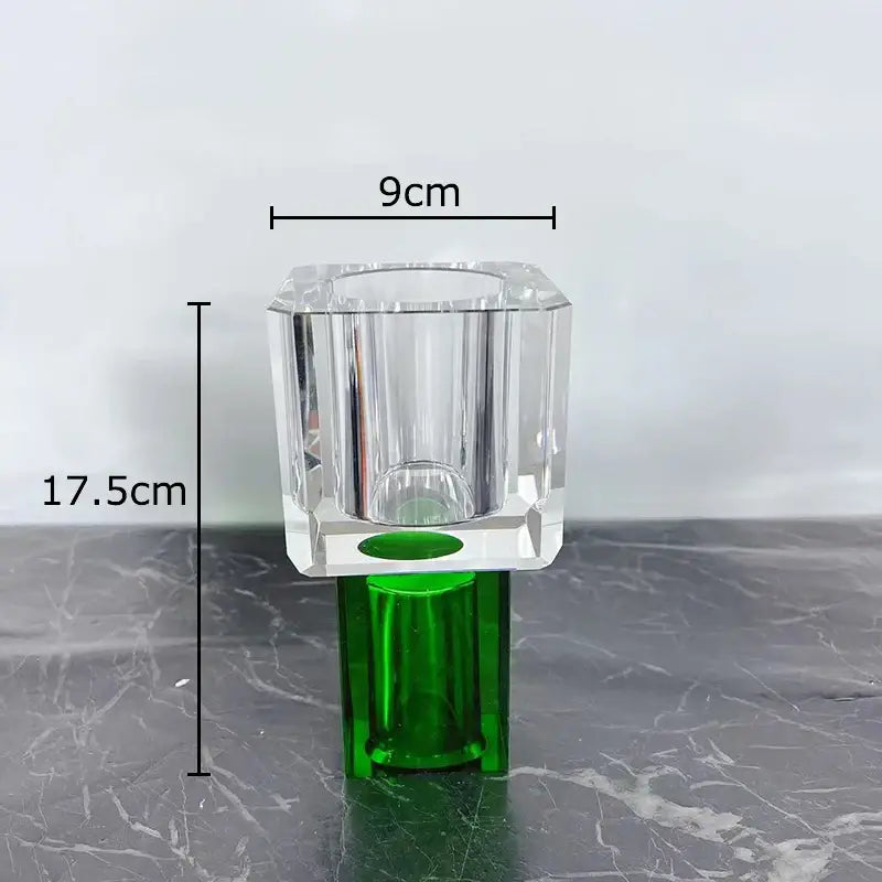 Clear faceted crystal vase with green base complementing modern geometric square artificial flowers decorbites decor