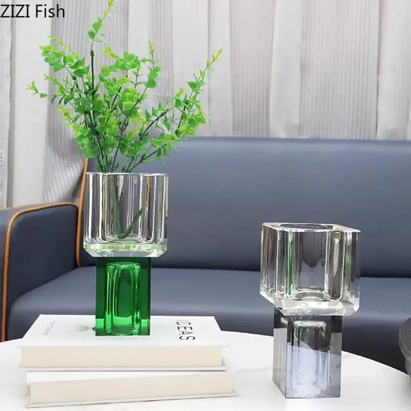 Clear glass vase with green base and vertical ridges holding artificial foliage for decorbites geometric square decor