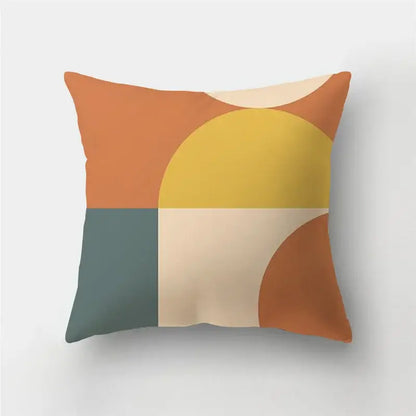 A square pillow case with modern geometric stripe patchwork design in warm orange, yellow, beige, and muted teal colors