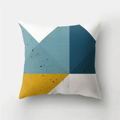Modern geometric stripe patchwork pillow case featuring light blue dark blue mustard yellow and white speckled fabric sections