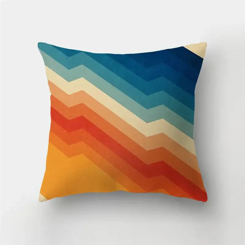 Modern geometric stripe patchwork pillow case featuring a vibrant chevron pattern in blue, teal, cream, orange, and red hues