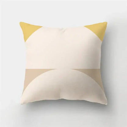 Cream-colored pillow case with modern geometric stripe patchwork featuring mustard yellow triangles for living room decor