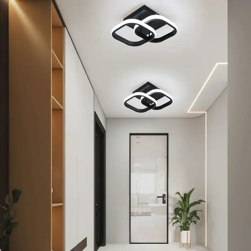 Modern geometric black and white decorbites acrylic led ceiling lamp with sleek interlocking design for bedroom decor