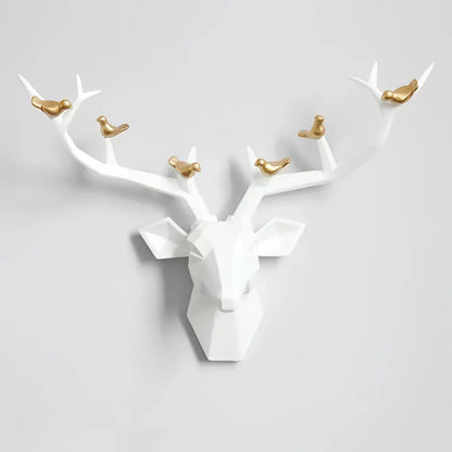 Modern geometric white and gold deer head wall decor with gold birds perched on antlers for living room use