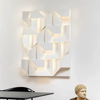 Modern geometric white grand sconce lamp with illuminated recessed panels for bedroom decor by decorbites grand sconce