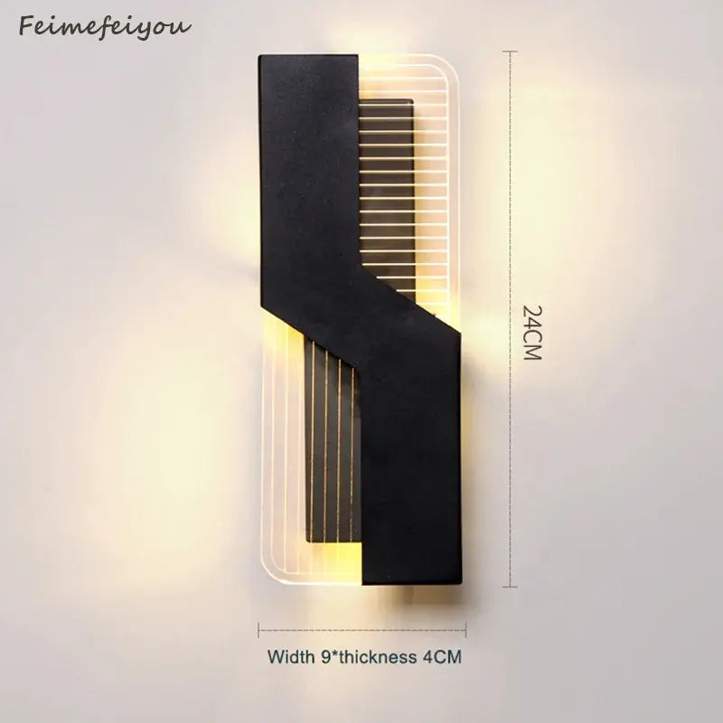 Modern black and translucent wall lamp with angular design and warm vertical led strips for decorbites led bedroom use