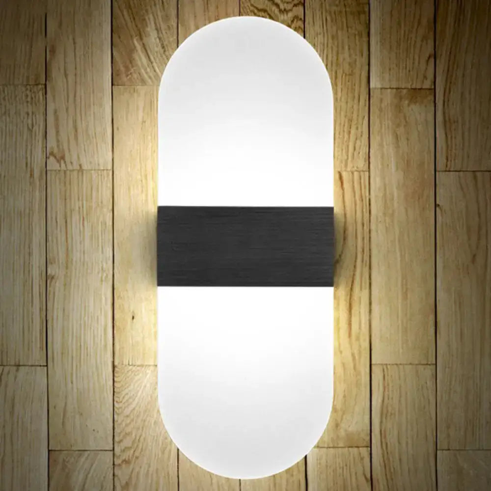Modern oval-shaped wall sconce with frosted white diffuser and matte black accent band for bedroom wall lamp lighting