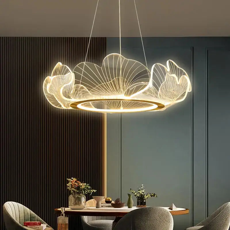 Modern ginkgo gold acrylic pendant light with wireframe lotus petals and warm golden glow for dining room decorbites chandelier