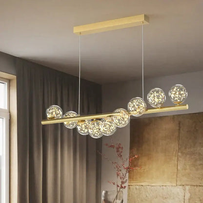 Modern glass ball gold chandelier featuring a gold-toned horizontal bar with clear glass spheres led dining pendant light decorbites glass ball