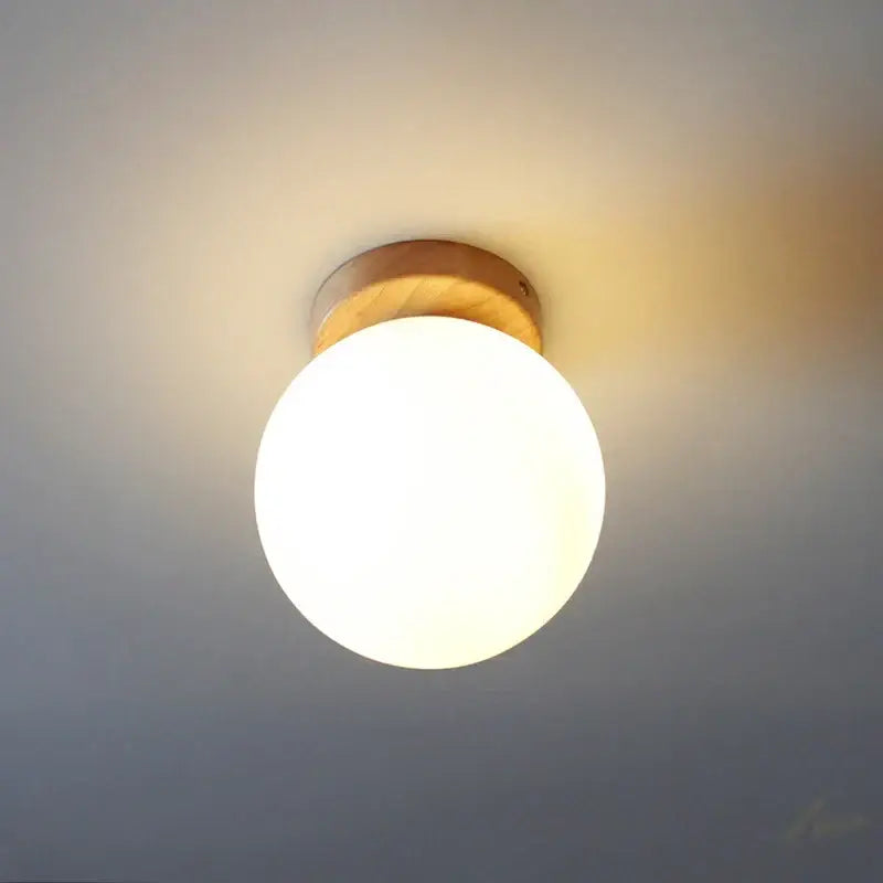 Modern glass ball led ceiling lamp with warm-toned frosted glass globe and natural wood mount for bedroom decorbites ceiling lamp
