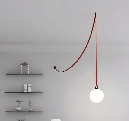 Modern glass ball led pendant light with a sleek curved red cord and smooth white bulb for living room decorbites glass ball