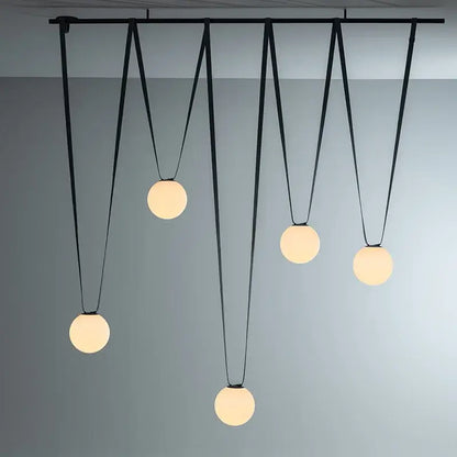 Modern black metal pendant light with five frosted glass ball led globes by decorbites for living room decor