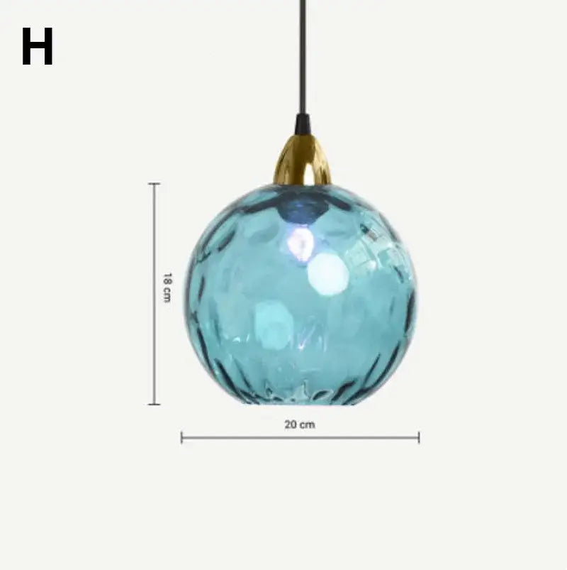 Modern glass ball lustre pendant lights featuring a textured blue glass ball with gold-toned metal fixture decorbites glass ball