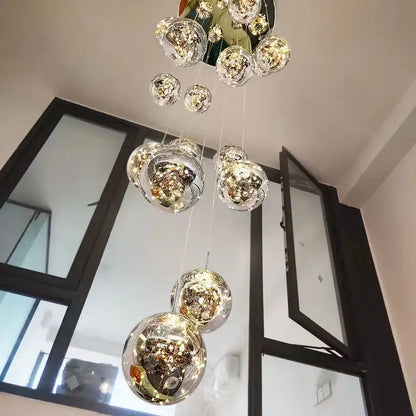 A modern glass ball spiral chandelier with clear glass spheres and golden filaments for dining room decorbites lighting