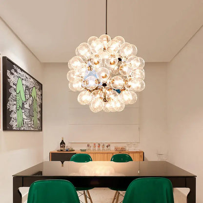 Modern glass bubble led hanging lamp featuring clear glass bulbs clustered around a brass central fixture for living room decorbites glass bubble