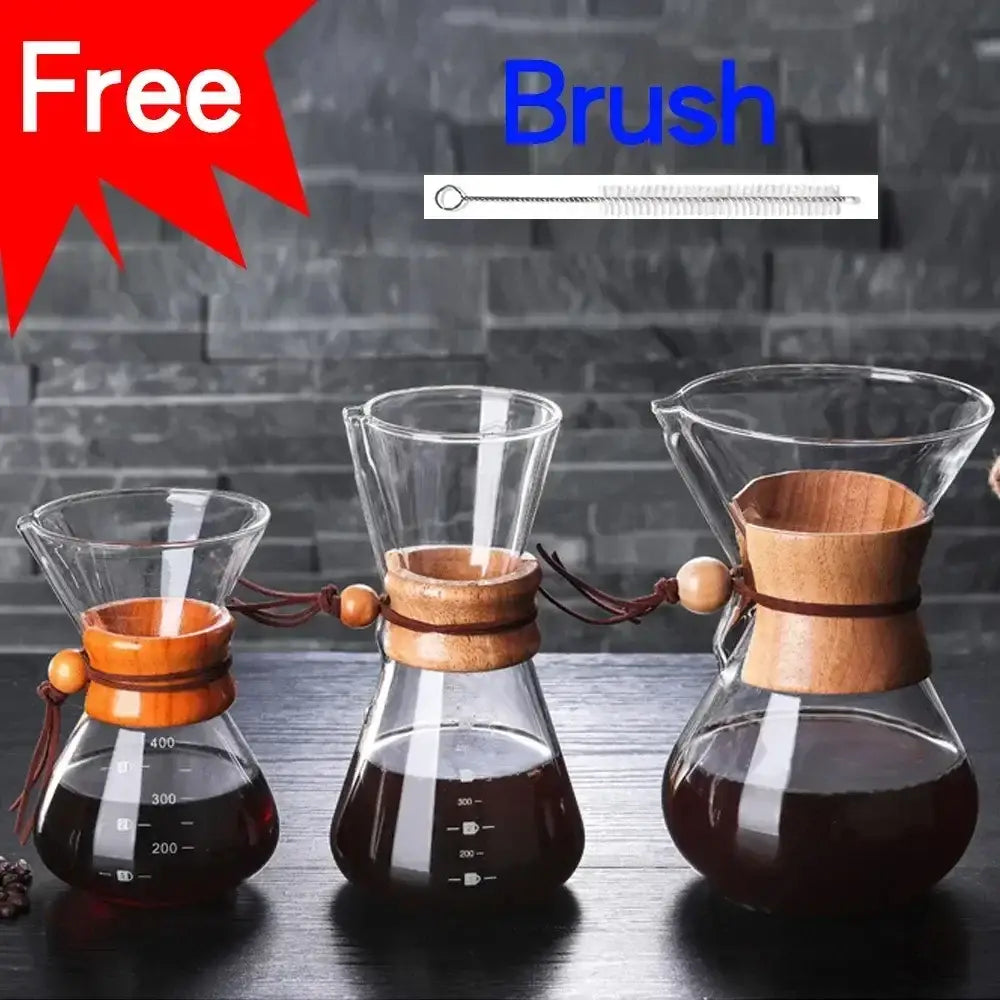 Set of three clear glass coffee kettles with wooden neck rings and steel filter drip for modern filter drip brewer