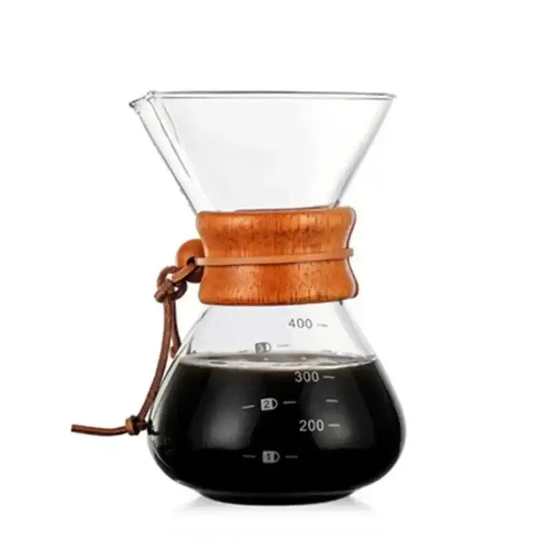 Clear glass coffee kettle with steel filter drip and warm wooden collar filled with dark brewed coffee for filter drip brewer