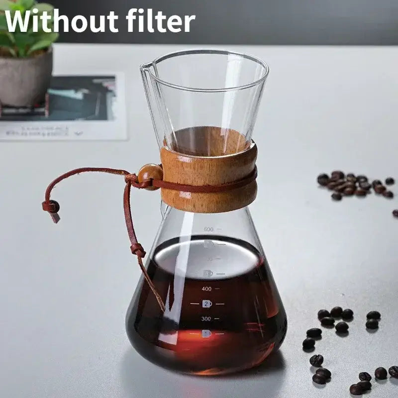 Clear glass coffee kettle with wooden collar and leather strap featuring steel filter drip for modern filter drip brewer