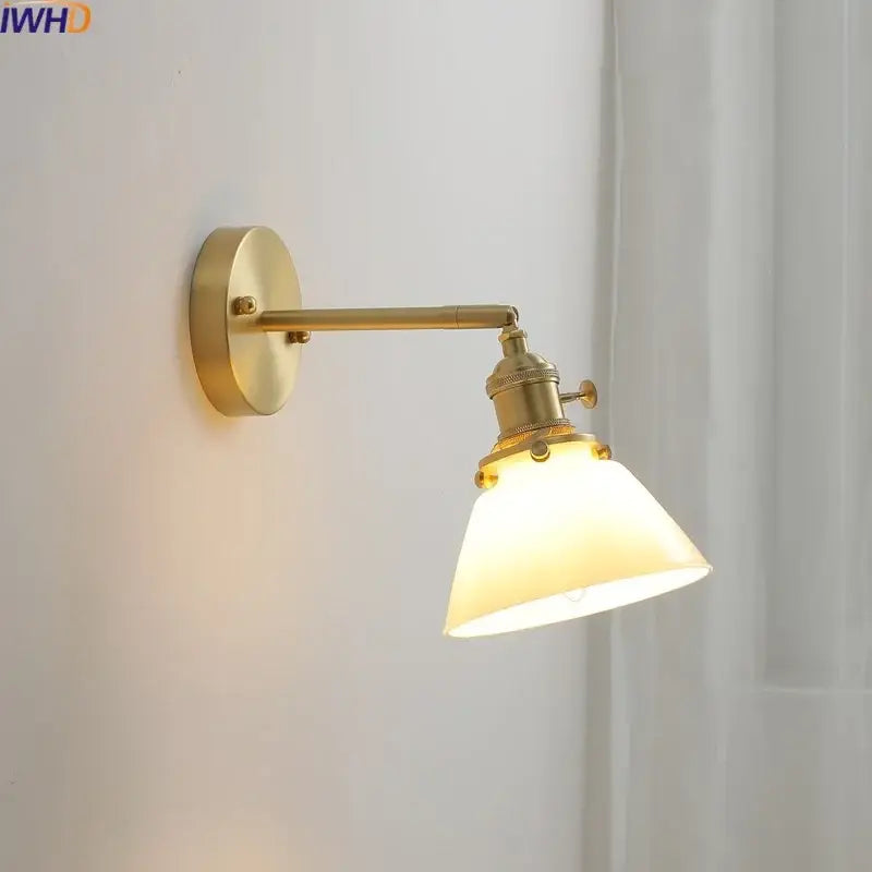 Brass-finished wall-mounted glass copper led wall light with warm frosted shade for modern bedroom reading