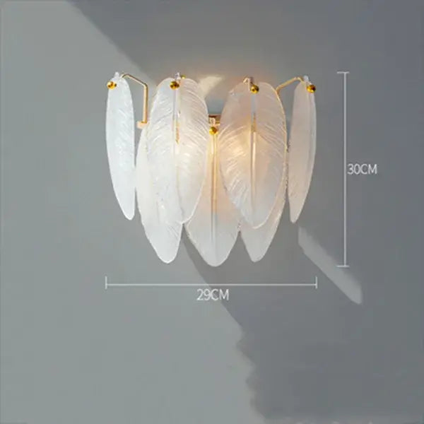 Elegant white feather chandelier wall sconce with gold-toned brass accents for modern living room decor
