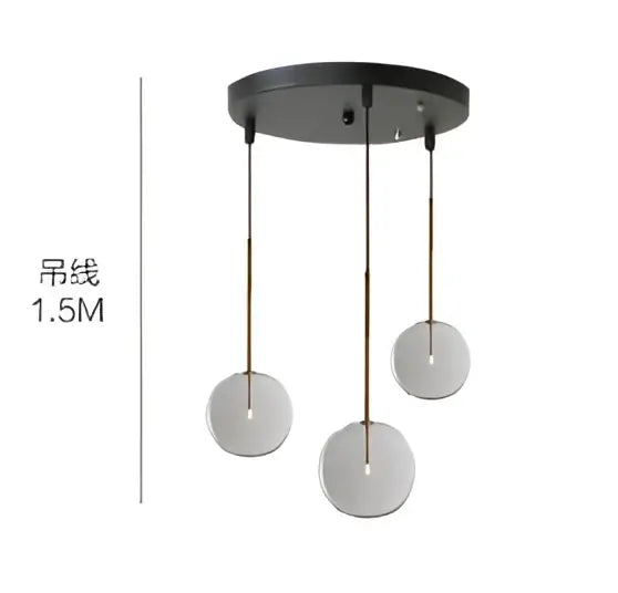 Black circular pendant light with three hanging glass globe chrome shades for modern dining room use