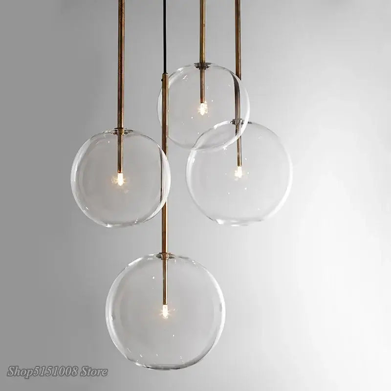 Modern glass globe chrome pendant light with clear glass globes and black cords for dining room lighting