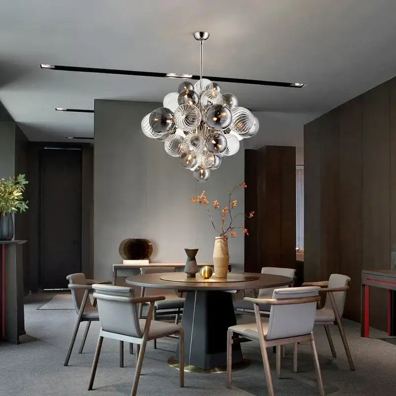 Modern glass globe led chandelier with clear and frosted glass spheres on a sleek metallic rod for living room decorbites glass globe