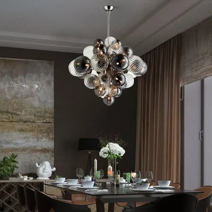 Modern glass globe led chandelier with clear and dark glass spheres on a sleek metallic rod for living room decorbites glass globe