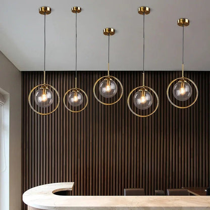 Modern Glass Globe Pendant Light With Gold Ring - Decorbites