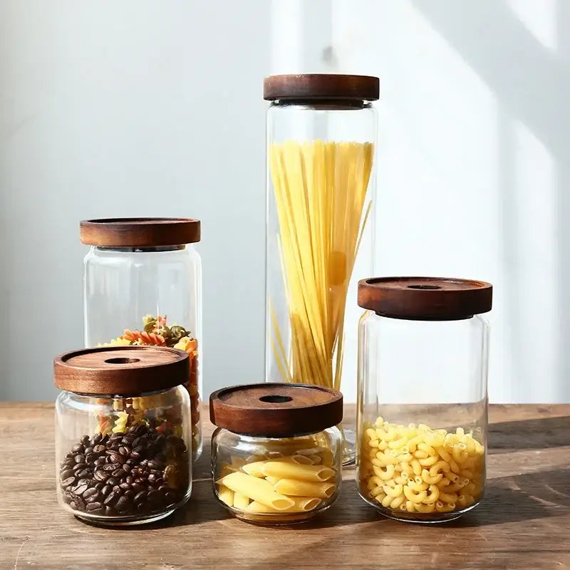 Clear glass hermetic storage jars with dark wood airtight lids holding pasta and coffee for kitchen decorbites glass hermetic use