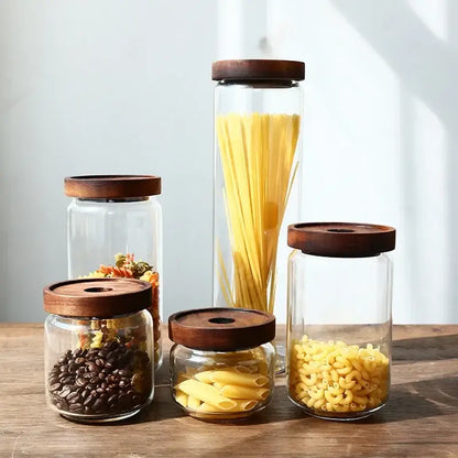 Clear glass hermetic storage jars with dark wood airtight lids holding pasta and coffee for kitchen decorbites glass hermetic use