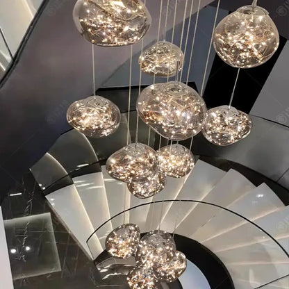 A modern glass orb pendant light with warm glowing led bulbs for elegant living room led illumination