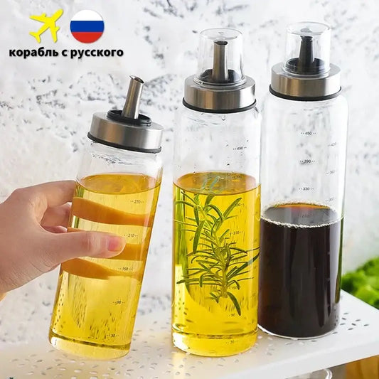 Modern glass seasoning storage bottle set with three clear glass dispensers and stainless steel pumps for kitchen use