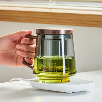 Modern glass tea cup with wood handle featuring decorbites glass tea clear infuser mug filled with green herbal infusion