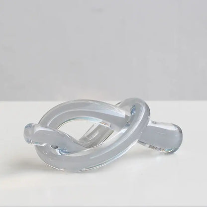 Modern glossy black geometric glass sculpture with smooth transparent knot design for living room decorbites decor