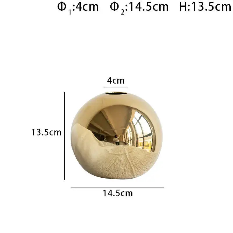 Shiny golden ball ceramic vase with reflective surface and textured base for modern decorbites golden ball decor