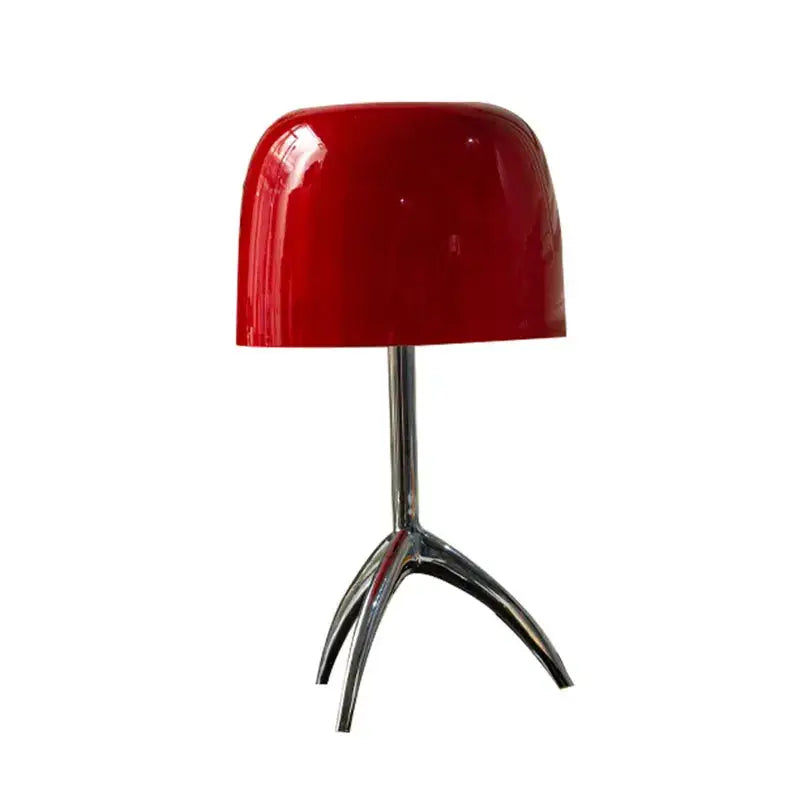 A modern glossy red candy color table light with a sleek lampshade and chrome tripod base for decorbites candy color decor