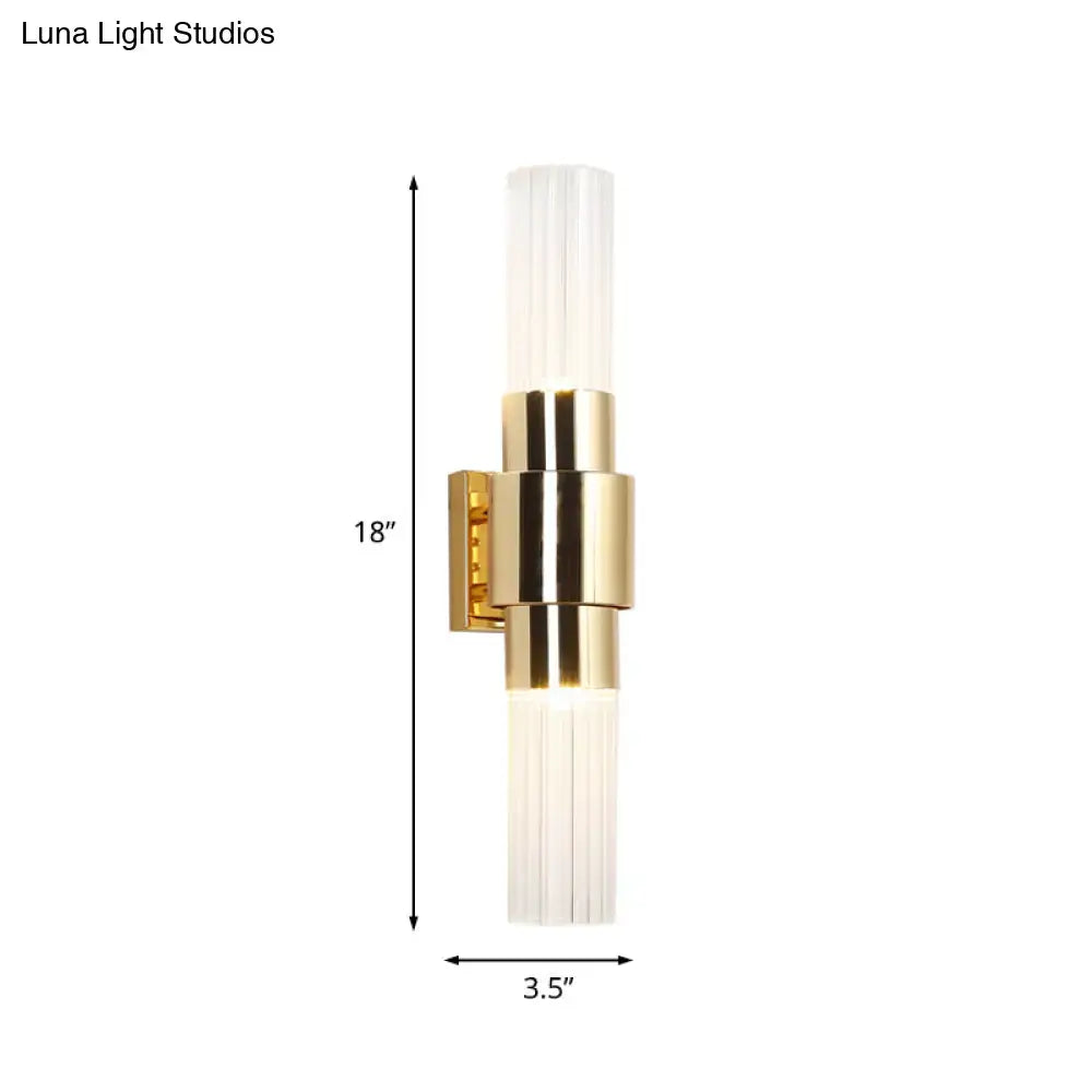Modern gold 2 light wall sconce with clear ribbed glass shades and bulb base for bathroom lighting