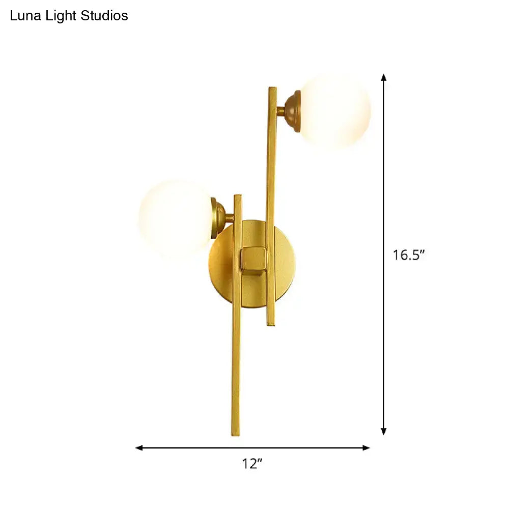 Modern gold wall lamp with two frosted glass spherical shades for living room light type illumination