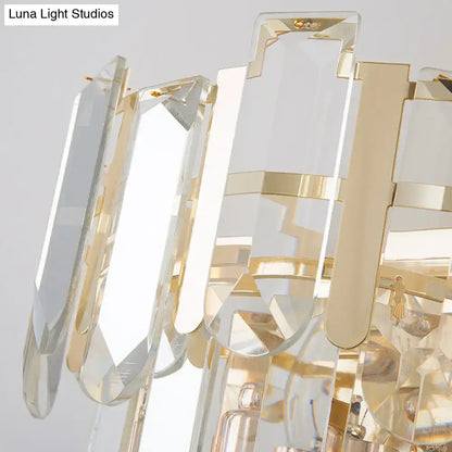 Modern gold 3-headed crystal wall sconce with clear faceted prisms in a geometric pattern 15 inch fixture