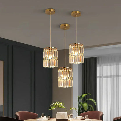 Modern gold chandelier pendant light with three tiered clear crystal cascades ideal for dining room lighting