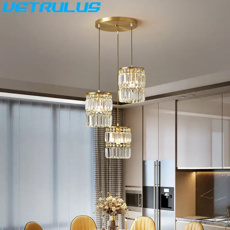 Modern gold 3 tier crystal chandelier pendant light featuring faceted glass elements for dining room use