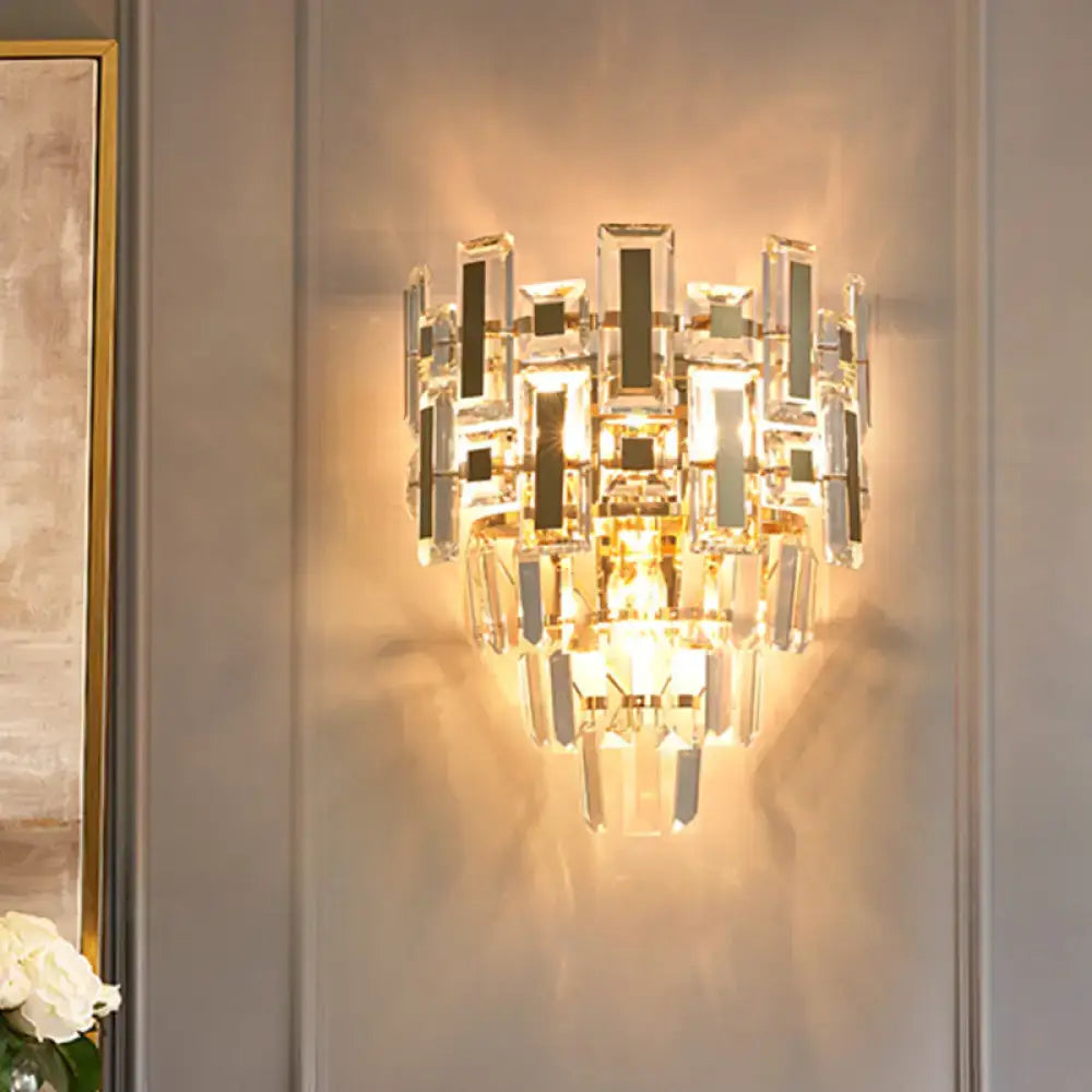 Modern gold 5 tier crystal wall lamp with cascading glass prisms for warm ambient light in family room flush mount