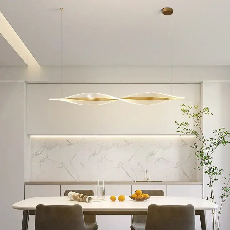 Modern gold acrylic led pendant lamp with sleek dual-winged design in brushed gold and white for dining room decorbites acrylic led