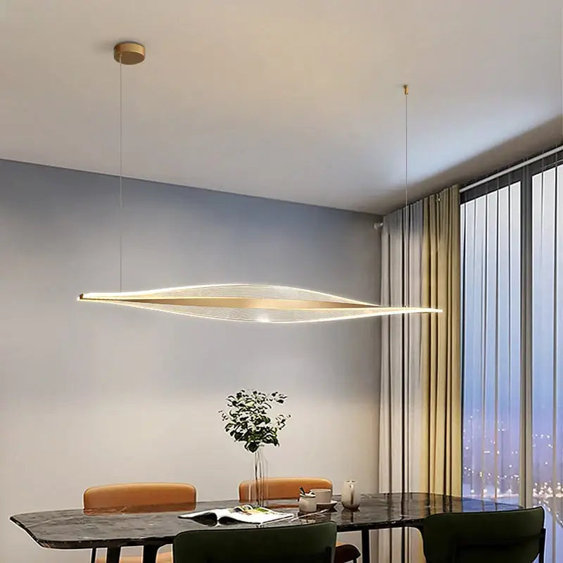 Modern gold acrylic led pendant lamp with sleek elongated oval design and embedded led lighting for dining room decorbites acrylic led