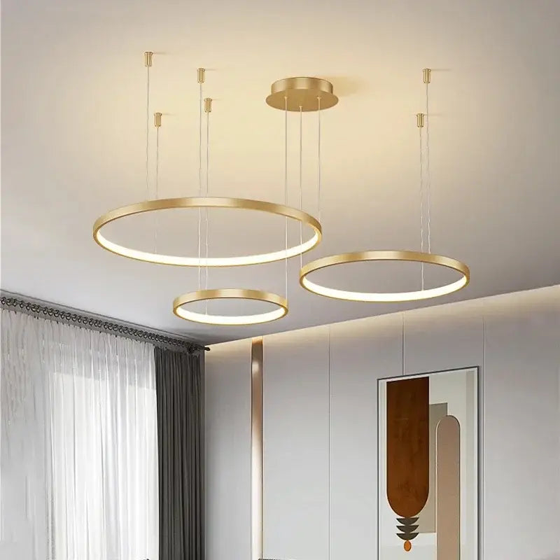 Modern gold acrylic led ring pendant light with sleek minimalist design featuring illuminated rings for dining room decorbites acrylic led