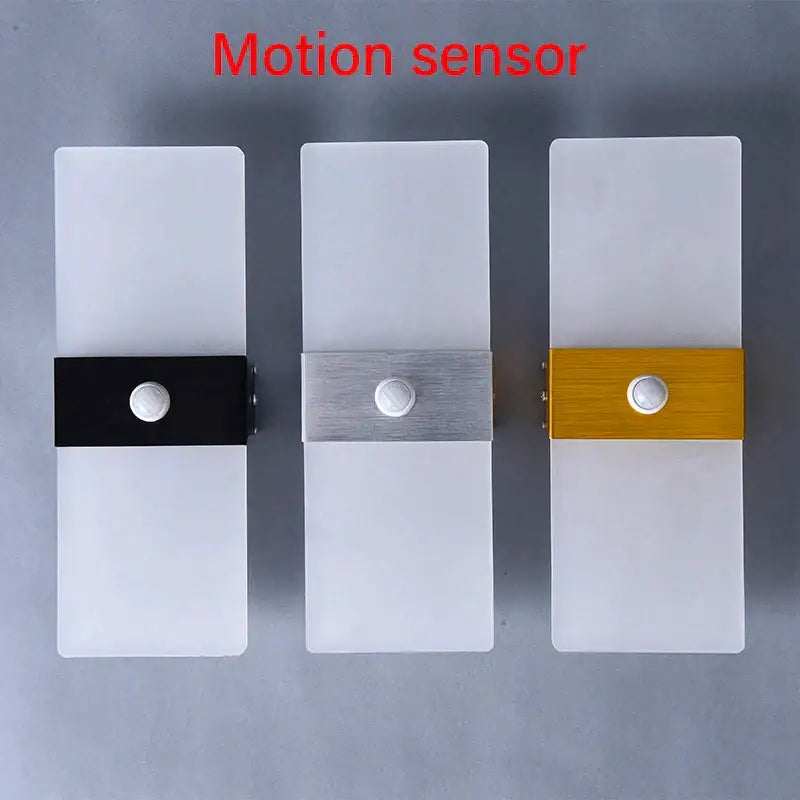Three modern motion sensor wall lamps with frosted acrylic led diffusers and gold silver black metallic accents decorbites acrylic led wall