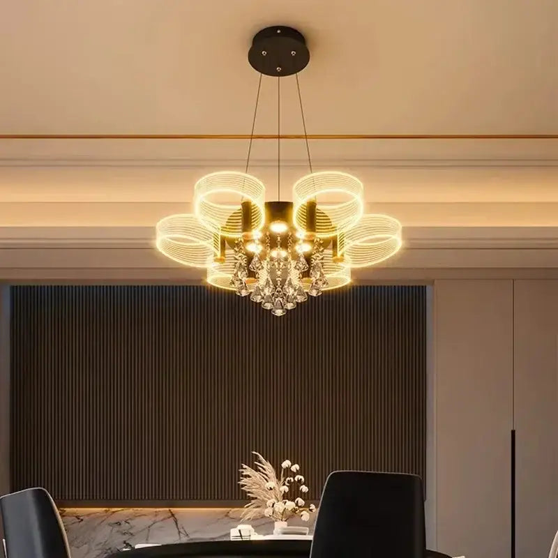 Modern gold acrylic lustre chandelier with glowing circular rings and crystal accents for living room decorbites acrylic lustre